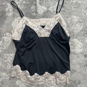 Beautiful black tank top with lace detail.
